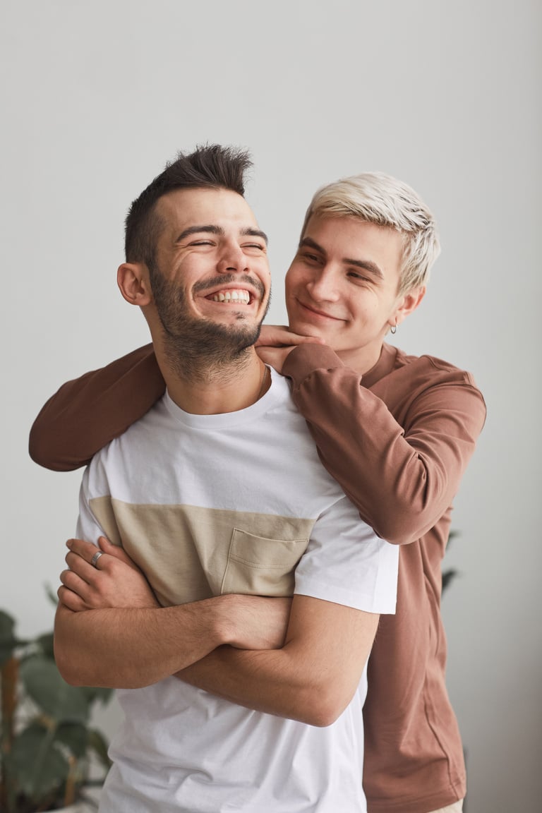 Carefree Gay Couple Embracing Each Other at Home