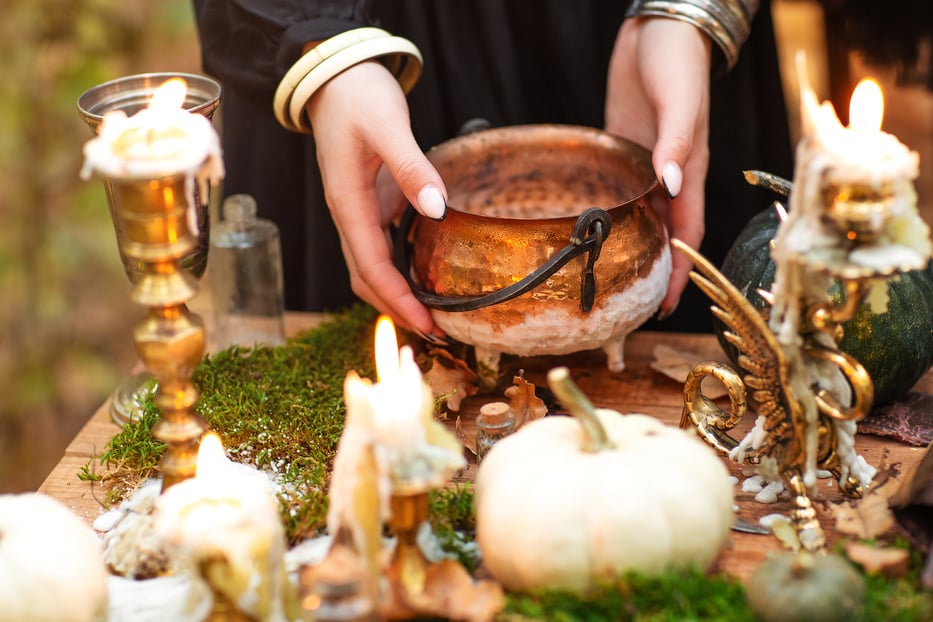 Young Witch Writing Spells in Forest