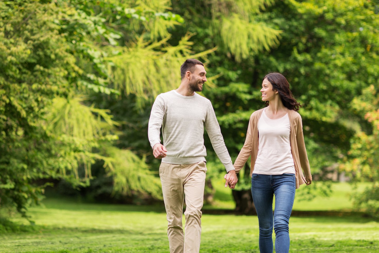 Happy Couple Walking in Summer Park