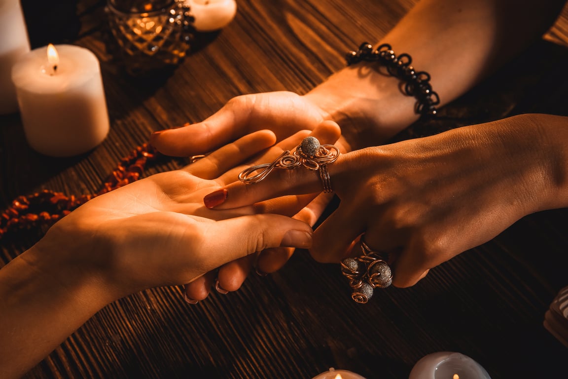 Fortune-Teller Reading a Person's Palm